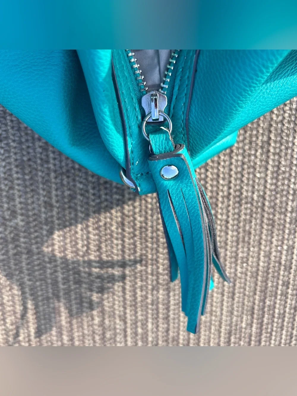 Liz Claiborne teal leather handbag with braided handles and tassel
